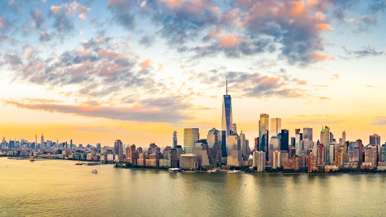 New York rock and metal bands working with a UK publicist to plan a music PR campaign, featuring laptops, press kits, and band posters — symbolizing global rock publicity and cross-Atlantic media promotion.
