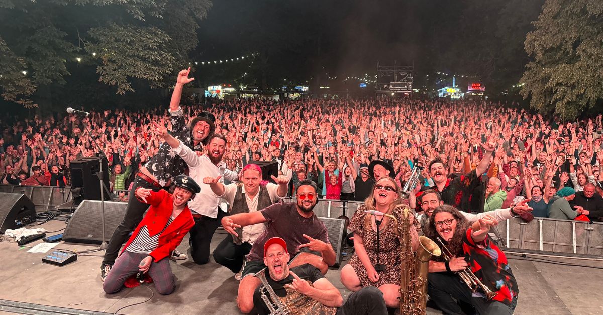 Big Band of Boom performing live on UK tour with full brass section, heavy guitars and festival crowd energy