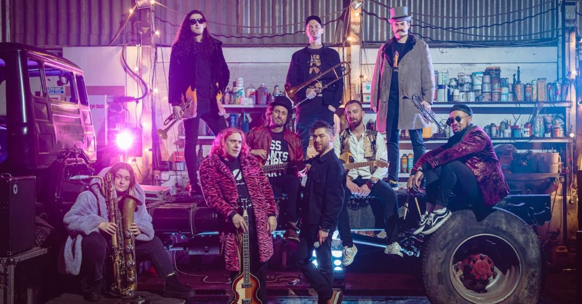 Big Band of Boom performing live on UK tour with full brass section, heavy guitars and festival crowd energy