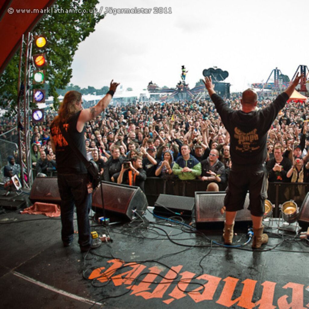 Rob Town performing live with Panic Cell on the main stage at Sonisphere Festival, demonstrating 20+ years of touring experience. Credit Mark Latham Photography